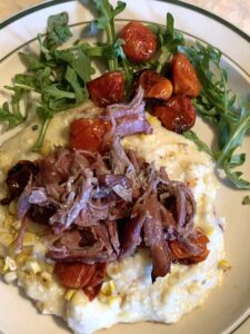 Roasted Tomato and Corn Grits with Duck Confit